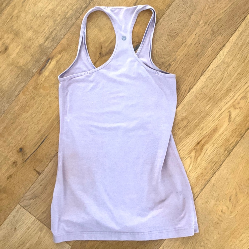 This is a Lululemon lavender colored tank top that is a size 6. reversible
